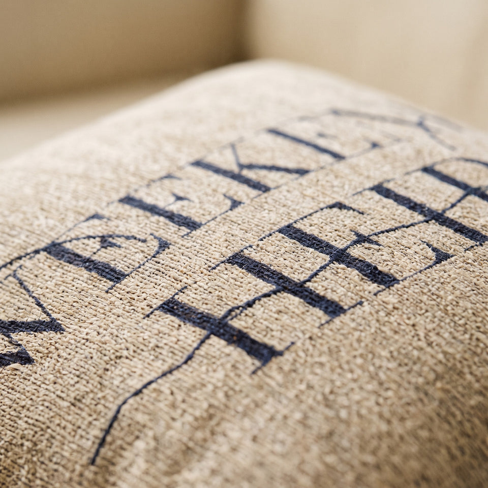 Detail | Weekend Heir Woven Pillow, the woven wordmark up close